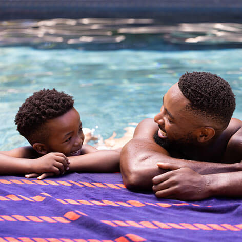 father and son in pool